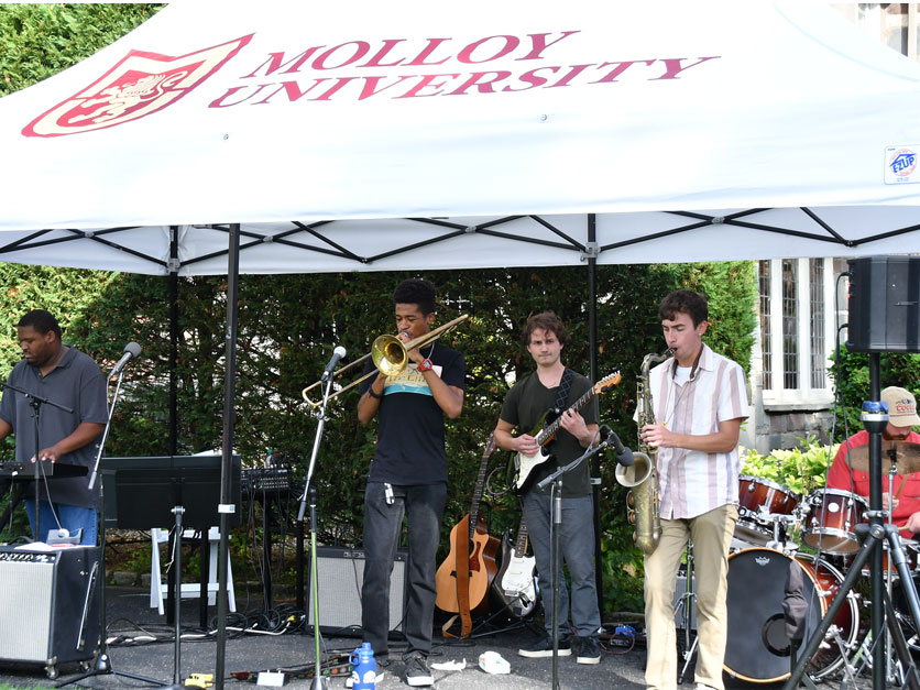 Students play instruments at Molloy Community Day