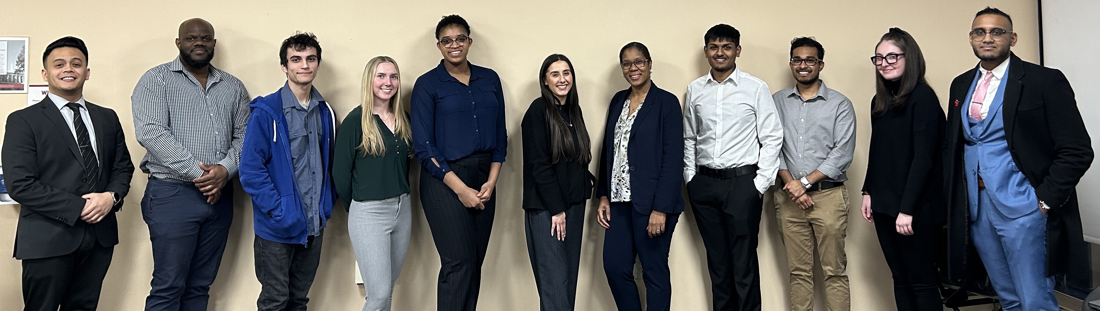 Graduate students standing in a row