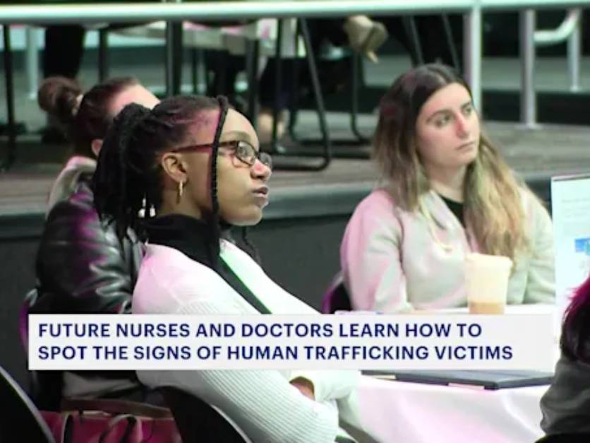 Molloy University nursing students at an event to prevent human trafficking