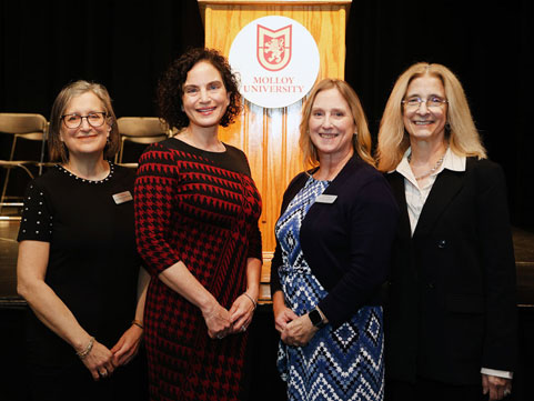  Molloy Nursing professors in front of podium during Meet the Legislative Candidates Night