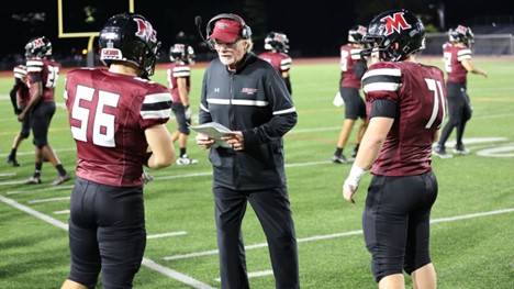 Molloy Lions Sprint Football Players on field with Molloy Sprint Coach