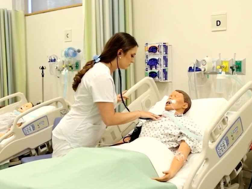 Nursing Students treating a high-tech mannequin stand in for patients